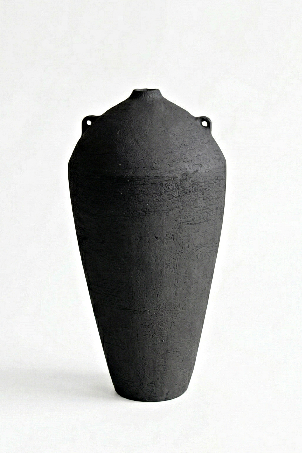 Kup III — Elevated | Sculptural Ceramic Vessel tall sculptural ceramic vase black stoneware unglazed textured surface modern minimalist interior object