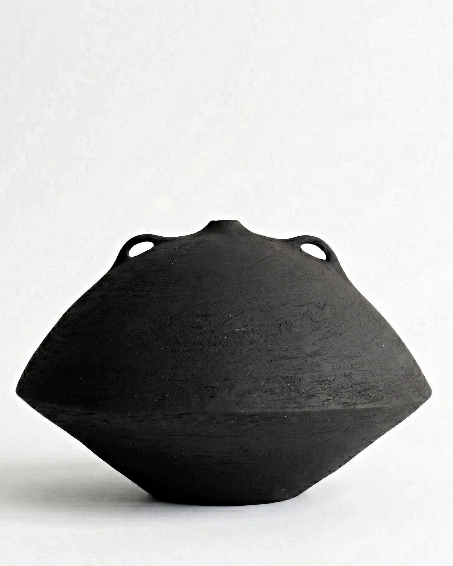 wide black sculptural ceramic vessel textured stoneware handmade minimalist decor object