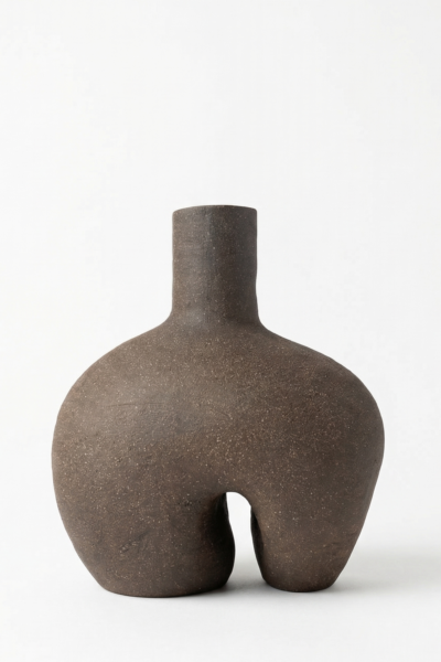 Monolith sculptural ceramic object in dark stoneware with raw matte texture, minimalist architectural form